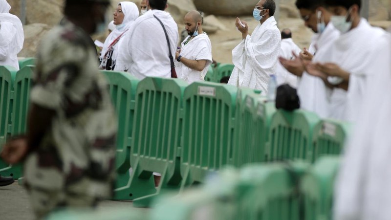 In this photo taken with low shutter speed, Muslim pilgrims circumambulate the Kaaba, the cubic building at the Grand Mosque, at the start the annual hajj pilgrimage, Sunday, July 18, 2021. The pilgrimage to Mecca required once in a lifetime of every Muslim who can afford it and is physically able to make it, used to draw more than 2 million people. But for a second straight year it has been curtailed due to the coronavirus with only vaccinated people in Saudi Arabia able to participate. (AP Photo/Amr Nabil)
