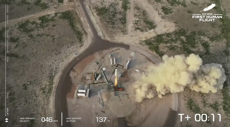 Peluncuran Blue Origin Bezos This photo provided by Blue Origin, Blue Origin's New Shepard rocket sits on a spaceport launch pad near Van Horn, Texas, Tuesday, July 20, 2021. The rocket that is scheduled to launch later this morning will carry passengers Jeff Bezos, founder of Amazon and space tourism company Blue Origin, his brother Mark Bezos, Oliver Daemen and Wally Funk. (Blue Origin via AP)