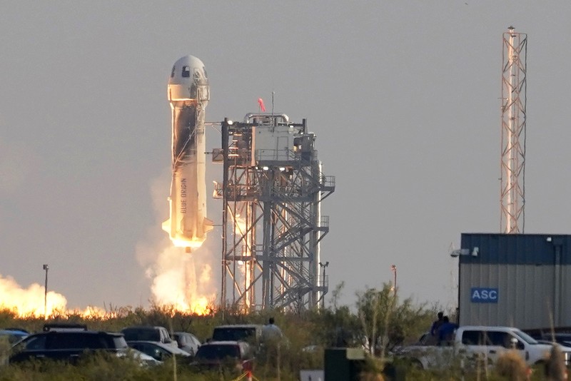 This photo provided by Blue Origin, Blue Origin's New Shepard rocket sits on a spaceport launch pad near Van Horn, Texas, Tuesday, July 20, 2021. The rocket that is scheduled to launch later this morning will carry passengers Jeff Bezos, founder of Amazon and space tourism company Blue Origin, his brother Mark Bezos, Oliver Daemen and Wally Funk. (Blue Origin via AP)