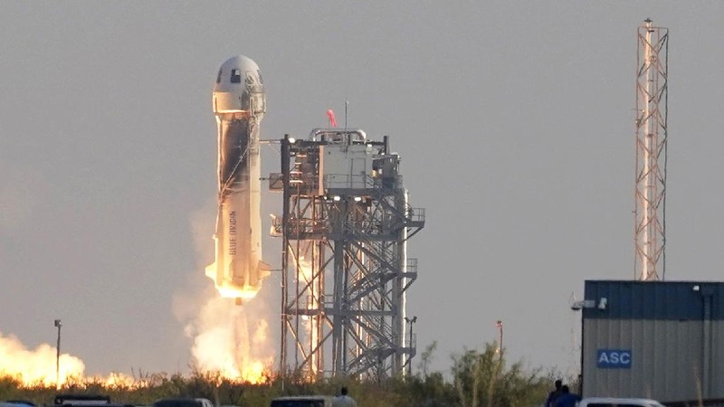 This photo provided by Blue Origin, Blue Origin's New Shepard rocket sits on a spaceport launch pad near Van Horn, Texas, Tuesday, July 20, 2021. The rocket that is scheduled to launch later this morning will carry passengers Jeff Bezos, founder of Amazon and space tourism company Blue Origin, his brother Mark Bezos, Oliver Daemen and Wally Funk. (Blue Origin via AP)