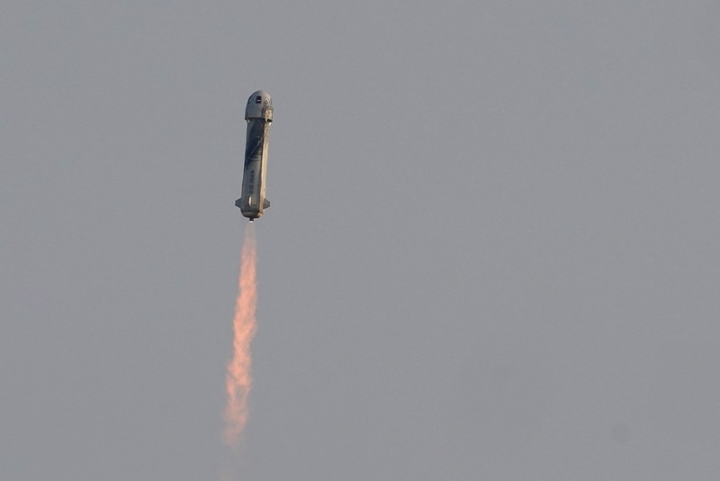 This photo provided by Blue Origin, Blue Origin's New Shepard rocket sits on a spaceport launch pad near Van Horn, Texas, Tuesday, July 20, 2021. The rocket that is scheduled to launch later this morning will carry passengers Jeff Bezos, founder of Amazon and space tourism company Blue Origin, his brother Mark Bezos, Oliver Daemen and Wally Funk. (Blue Origin via AP)