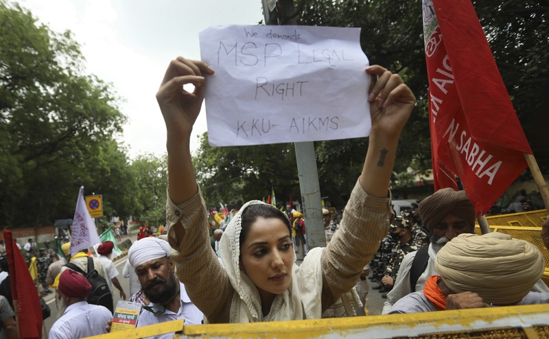 Farmers shout anti government slogans during a protest in New Delhi, India, Thursday, July 22, 2021. More than 200 farmers on Thursday began a protest near India's Parliament to mark eight months of their agitation against new agricultural laws that they say will devastate their income. (AP Photo/Manish Swarup)