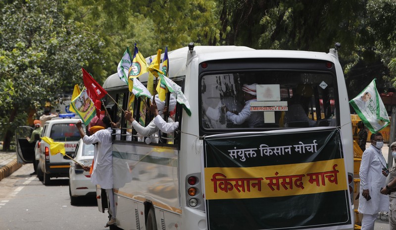 Farmers shout anti government slogans during a protest in New Delhi, India, Thursday, July 22, 2021. More than 200 farmers on Thursday began a protest near India's Parliament to mark eight months of their agitation against new agricultural laws that they say will devastate their income. (AP Photo/Manish Swarup)