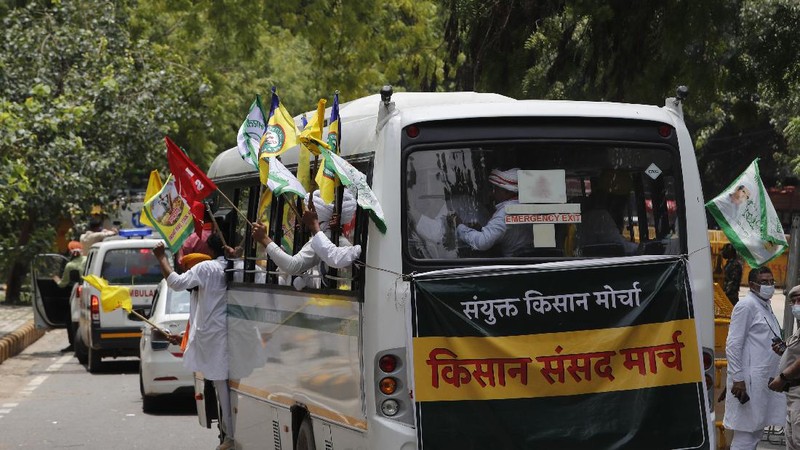 Farmers shout anti government slogans during a protest in New Delhi, India, Thursday, July 22, 2021. More than 200 farmers on Thursday began a protest near India's Parliament to mark eight months of their agitation against new agricultural laws that they say will devastate their income. (AP Photo/Manish Swarup)