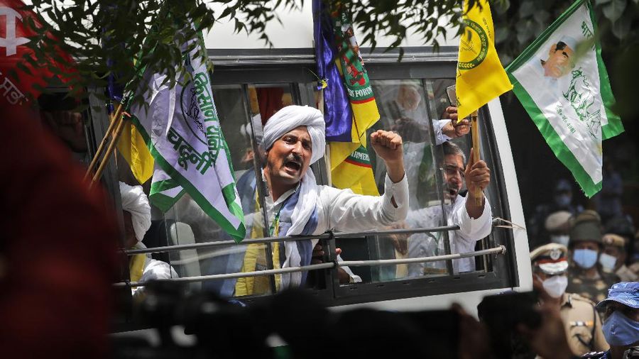 Farmers shout anti government slogans during a protest in New Delhi, India, Thursday, July 22, 2021. More than 200 farmers on Thursday began a protest near India's Parliament to mark eight months of their agitation against new agricultural laws that they say will devastate their income. (AP Photo/Manish Swarup)