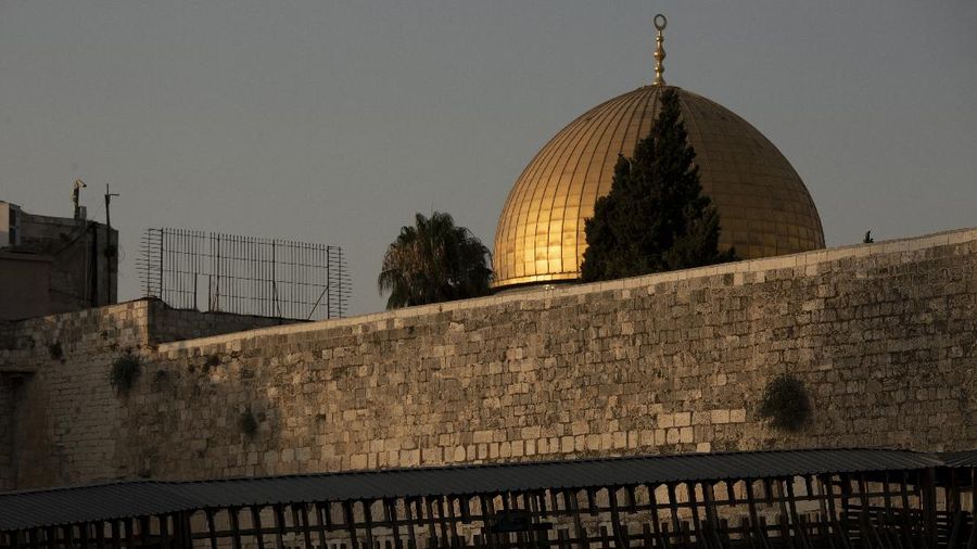 The Dome of the Rock mosque is seen above the Mughrabi Bridge, a wooden pedestrian bridge connecting the wall to the Al Aqsa Mosque compound, in Jerusalem's Old City, Tuesday, July 20, 2021. The rickety bridge allowing access to Jerusalem's most sensitive holy site is at risk of collapse, according to experts. But the flashpoint shrine's delicate position at ground-zero of the Israeli-Palestinian conflict has prevented its repair for more than a decade. (AP Photo/Maya Alleruzzo)