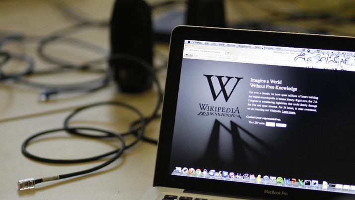 Wikipedia FILE - In this Wednesday, Jan. 18, 2012 file photo, a blackout landing page is displayed on a laptop computer screen inside the