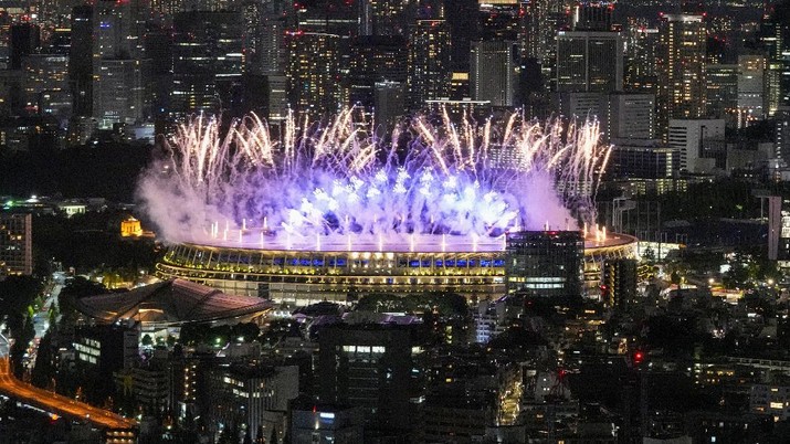 Fireworks illuminate over National Stadium during the opening ceremony of 2020 Tokyo Olympics, Friday, July 23, 2021, in Tokyo. (AP Photo/Kiichiro Sato)