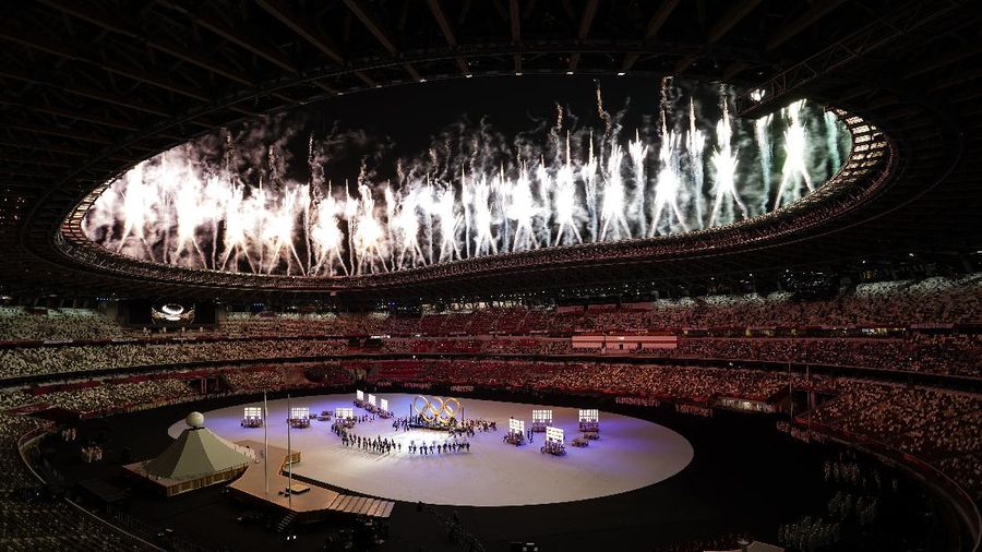 Fireworks illuminate over National Stadium during the opening ceremony of 2020 Tokyo Olympics, Friday, July 23, 2021, in Tokyo. (AP Photo/Kiichiro Sato)