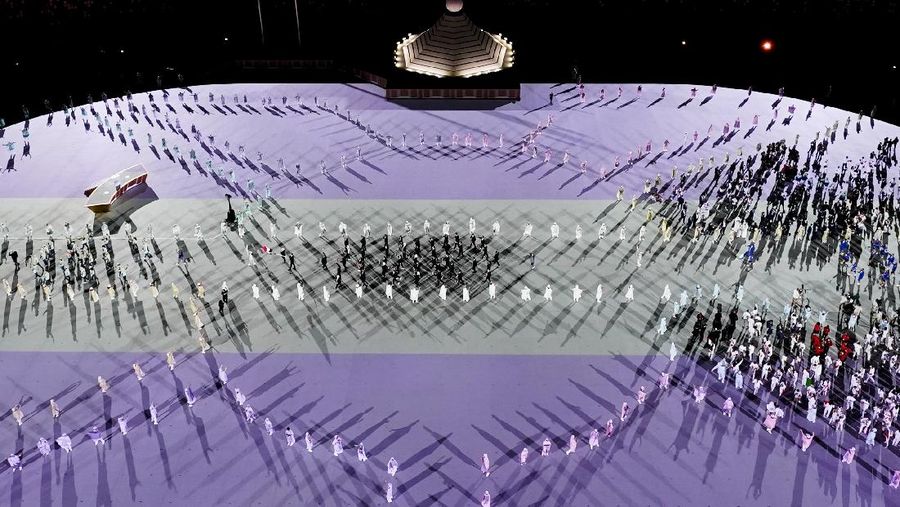 Fireworks illuminate over National Stadium during the opening ceremony of 2020 Tokyo Olympics, Friday, July 23, 2021, in Tokyo. (AP Photo/Kiichiro Sato)
