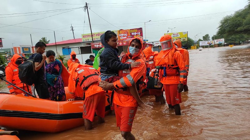 People stranded in flood waters are rescued Kolhapur in western Maharashtra state, India, Saturday, July 24, 2021. Officials say landslides and flooding triggered by heavy monsoon rain have killed more than 100 people in western India. More than 1,000 people trapped by floodwaters have been rescued. (AP Photo)