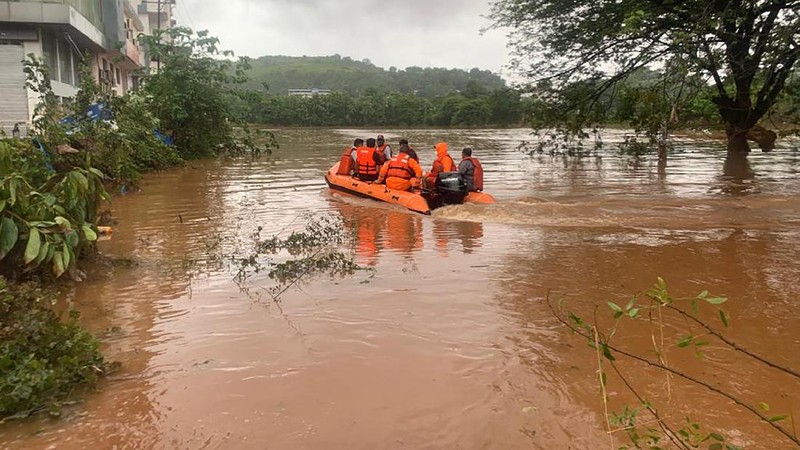 People stranded in flood waters are rescued Kolhapur in western Maharashtra state, India, Saturday, July 24, 2021. Officials say landslides and flooding triggered by heavy monsoon rain have killed more than 100 people in western India. More than 1,000 people trapped by floodwaters have been rescued. (AP Photo)
