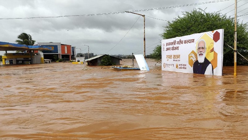 People stranded in flood waters are rescued Kolhapur in western Maharashtra state, India, Saturday, July 24, 2021. Officials say landslides and flooding triggered by heavy monsoon rain have killed more than 100 people in western India. More than 1,000 people trapped by floodwaters have been rescued. (AP Photo)
