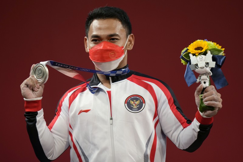 Eko Yuli Irawan Eco Yuli Irawan of Indonesia competes in the men's 61kg weightlifting event, at the 2020 Summer Olympics, Sunday, July 25, 2021, in Tokyo, Japan. (AP Photo/Luca Bruno)