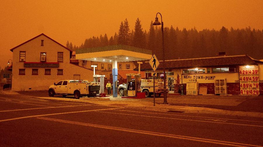 Flames consume vehicles as the Dixie Fire tears through the Indian Falls community in Plumas County, Calif., Saturday, July 24, 2021. The fire destroyed multiple residences in the area. (AP Photo/Noah Berger)