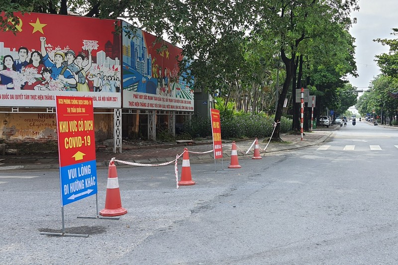People are turned away at a checkpoint at an entrance to Hanoi, Vietnam, Saturday, July 24, 2021. Vietnam announced a 15-day lockdown in the capital Hanoi starting Saturday as a coronavirus surge spread from the southern Mekong Delta region. (AP Photo/Hieu Dinh)