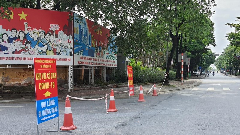 People are turned away at a checkpoint at an entrance to Hanoi, Vietnam, Saturday, July 24, 2021. Vietnam announced a 15-day lockdown in the capital Hanoi starting Saturday as a coronavirus surge spread from the southern Mekong Delta region. (AP Photo/Hieu Dinh)