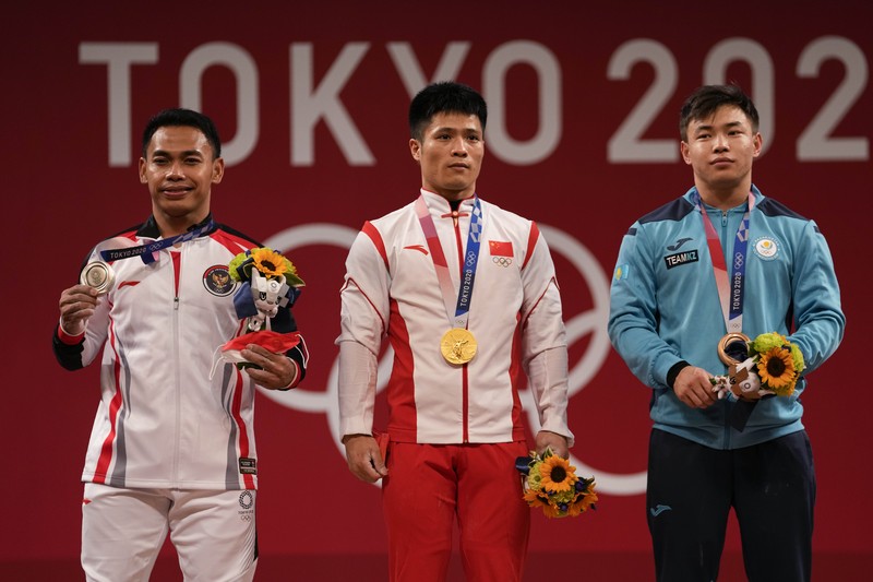 Eko Yuli Irawan Eco Yuli Irawan of Indonesia competes in the men's 61kg weightlifting event, at the 2020 Summer Olympics, Sunday, July 25, 2021, in Tokyo, Japan. (AP Photo/Luca Bruno)