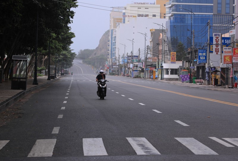 People are turned away at a checkpoint at an entrance to Hanoi, Vietnam, Saturday, July 24, 2021. Vietnam announced a 15-day lockdown in the capital Hanoi starting Saturday as a coronavirus surge spread from the southern Mekong Delta region. (AP Photo/Hieu Dinh)