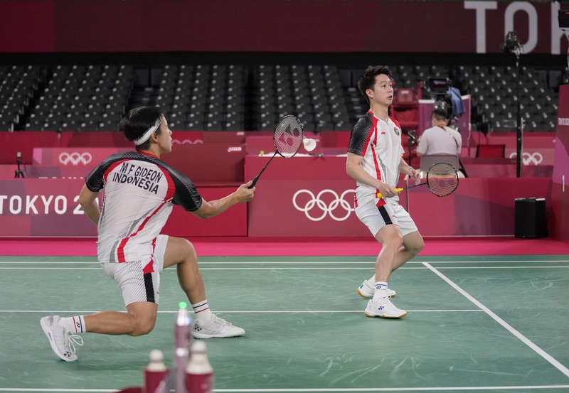 Kevin Sanjaya Sukamuljo dan Marcus Fernaldi Gideon di Olimpiade Tokyo 2020. (AP/Dita Alangkara) Kevin Sanjaya Sukamuljo dan Marcus Fernaldi Gideon di Olimpiade Tokyo 2020. (AP/Dita Alangkara)