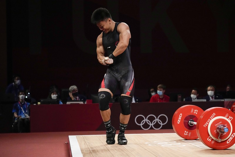 Rahmat Erwin Abdullah Rhamat Erwin Abdullah of Indonesia competes in the men's 73kg weightlifting event, at the 2020 Summer Olympics, Wednesday, July 28, 2021, in Tokyo, Japan. (AP Photo/Luca Bruno)