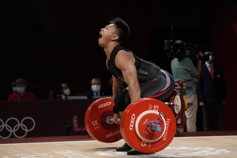 Rahmat Erwin Abdullah Rhamat Erwin Abdullah of Indonesia competes in the men's 73kg weightlifting event, at the 2020 Summer Olympics, Wednesday, July 28, 2021, in Tokyo, Japan. (AP Photo/Luca Bruno)