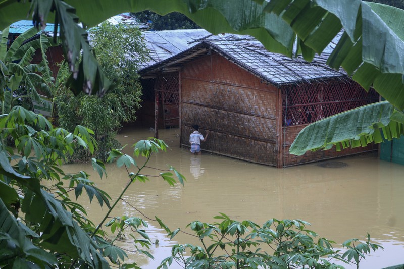 A view of inundated shelters following heavy rains at the Rohingya refugee camp in Kutupalong, Bangladesh, Wednesday, July 28, 2021. Days of heavy rains have brought thousands of shelters in various Rohingya refugee camps in Southern Bangladesh under water, rendering thousands of refugees homeless. (AP Photo/ Shafiqur Rahman)