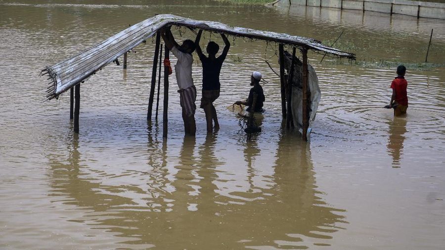 A view of inundated shelters following heavy rains at the Rohingya refugee camp in Kutupalong, Bangladesh, Wednesday, July 28, 2021. Days of heavy rains have brought thousands of shelters in various Rohingya refugee camps in Southern Bangladesh under water, rendering thousands of refugees homeless. (AP Photo/ Shafiqur Rahman)