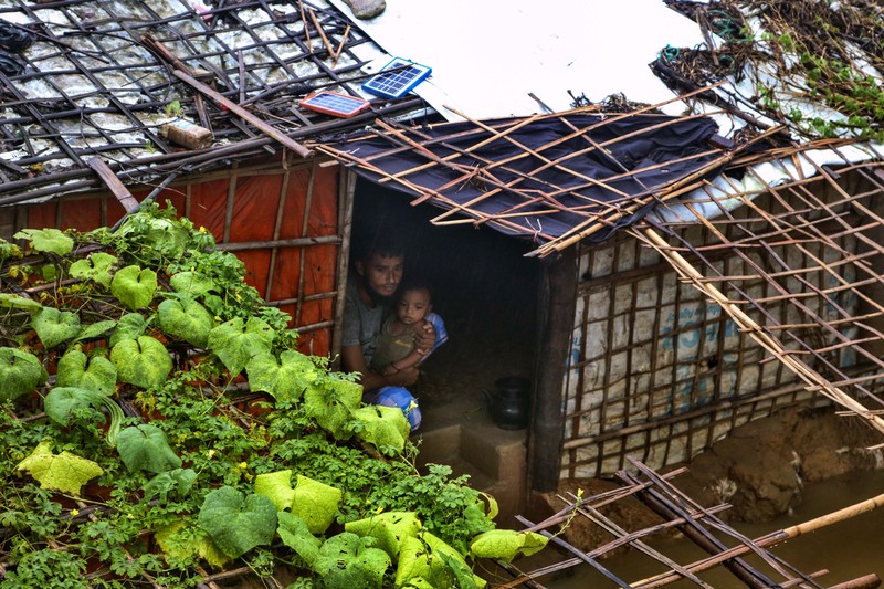 A view of inundated shelters following heavy rains at the Rohingya refugee camp in Kutupalong, Bangladesh, Wednesday, July 28, 2021. Days of heavy rains have brought thousands of shelters in various Rohingya refugee camps in Southern Bangladesh under water, rendering thousands of refugees homeless. (AP Photo/ Shafiqur Rahman)