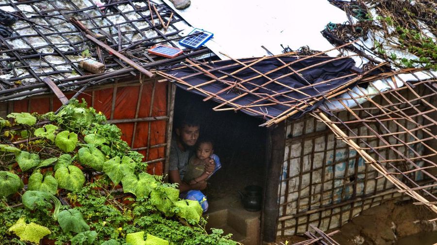 A view of inundated shelters following heavy rains at the Rohingya refugee camp in Kutupalong, Bangladesh, Wednesday, July 28, 2021. Days of heavy rains have brought thousands of shelters in various Rohingya refugee camps in Southern Bangladesh under water, rendering thousands of refugees homeless. (AP Photo/ Shafiqur Rahman)