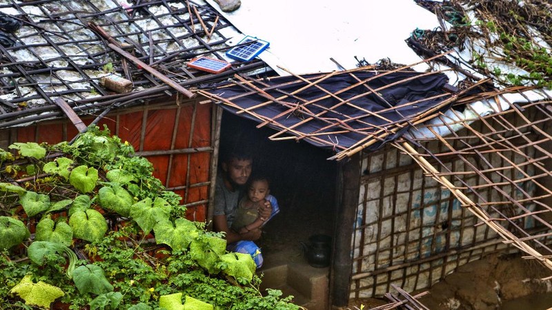 A view of inundated shelters following heavy rains at the Rohingya refugee camp in Kutupalong, Bangladesh, Wednesday, July 28, 2021. Days of heavy rains have brought thousands of shelters in various Rohingya refugee camps in Southern Bangladesh under water, rendering thousands of refugees homeless. (AP Photo/ Shafiqur Rahman)
