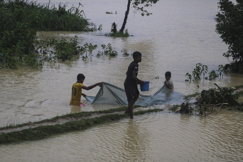 Bangladesh Rohingya Refugees A view of inundated shelters following heavy rains at the Rohingya refugee camp in Kutupalong, Bangladesh, Wednesday, July 28, 2021. Days of heavy rains have brought thousands of shelters in various Rohingya refugee camps in Southern Bangladesh under water, rendering thousands of refugees homeless. (AP Photo/ Shafiqur Rahman)