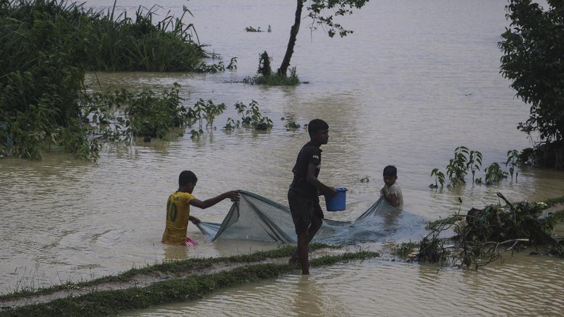 A view of inundated shelters following heavy rains at the Rohingya refugee camp in Kutupalong, Bangladesh, Wednesday, July 28, 2021. Days of heavy rains have brought thousands of shelters in various Rohingya refugee camps in Southern Bangladesh under water, rendering thousands of refugees homeless. (AP Photo/ Shafiqur Rahman)