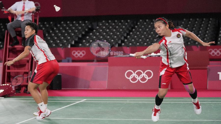 Indonesia's Greysia Polii, left, and Apriyani Rahayu celebrates after making a point during their women's doubles gold medal match against China's Chen Qing Chen and Jia Yi Fan at the 2020 Summer Olympics, Monday, Aug. 2, 2021, in Tokyo, Japan. (AP Photo/Markus Schreiber)