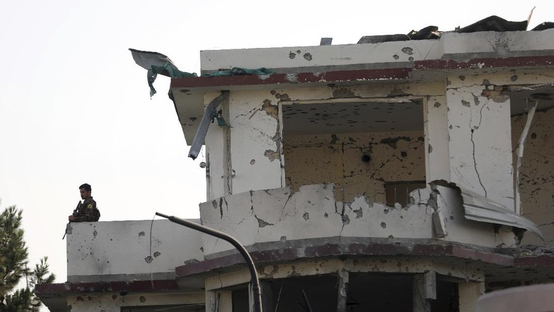 Afghan security personnel stand guard following an attack in Kabul, Afghanistan, Wednesday, Aug. 4, 2021. A powerful explosion rocked an upscale neighborhood of Afghanistan's capital Tuesday in an attack that apparently targeted the country's acting defense minister. (AP Photo/Rahmat Gul)