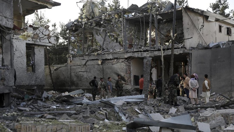 Afghan security personnel stand guard following an attack in Kabul, Afghanistan, Wednesday, Aug. 4, 2021. A powerful explosion rocked an upscale neighborhood of Afghanistan's capital Tuesday in an attack that apparently targeted the country's acting defense minister. (AP Photo/Rahmat Gul)