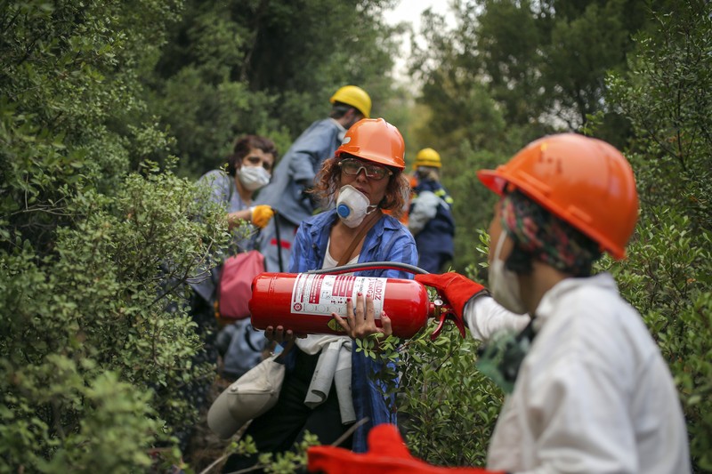 Turkey Wildfires Turkish volunteers head to fight wildfires in Turgut village, near tourist resort of Marmaris, Mugla, Turkey, Wednesday, Aug. 4, 2021. As Turkish fire crews pressed ahead Tuesday with their weeklong battle against blazes tearing through forests and villages on the country's southern coast, President Recep Tayyip Erdogan's government faced increased criticism over its apparent poor response and inadequate preparedness for large-scale wildfires.(AP Photo/Emre Tazegul)