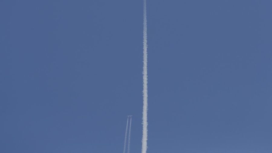 Special guests chat as they wait for Virgin Galactic founder Richard Branson's launch to space aboard his own rocket ship near Truth or Consequences, New Mexico, Sunday, July 11, 2021. (AP Photo/Andres Leighton)