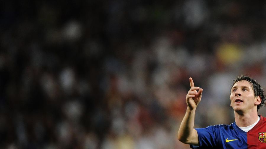 Barcelona's Lionel Messi from Argentina celebrates after scoring a goal against Real Madrid during his La Liga soccer match at the Santiago Bernabeu stadium in Madrid, Saturday, May 2, 2009. (AP Photo/Daniel Ochoa de Olza)