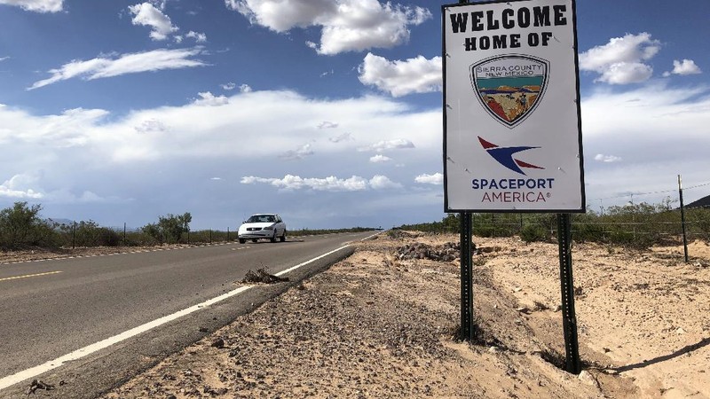 Special guests chat as they wait for Virgin Galactic founder Richard Branson's launch to space aboard his own rocket ship near Truth or Consequences, New Mexico, Sunday, July 11, 2021. (AP Photo/Andres Leighton)