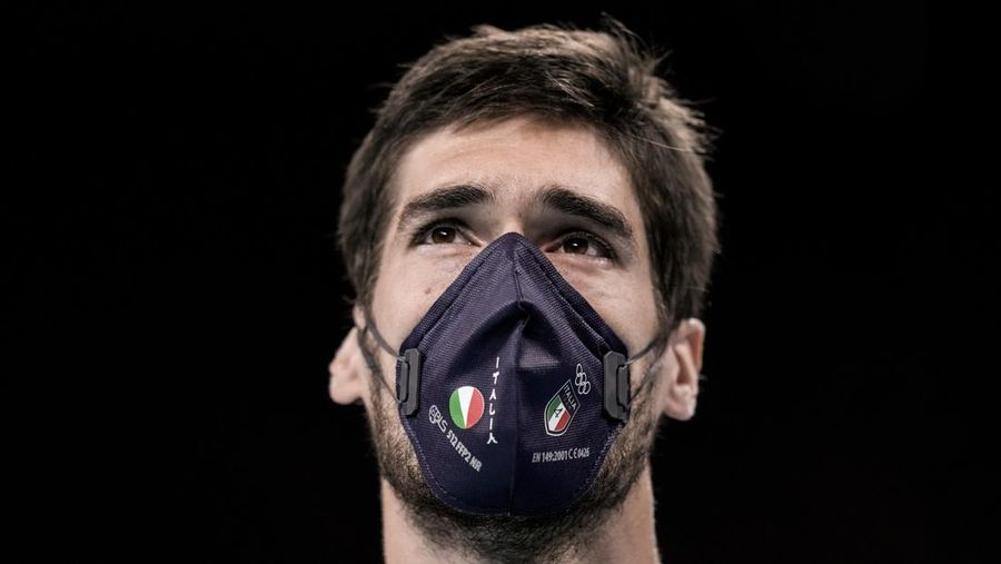Italy's Luca Vettori wearing a face mask pauses before the men's volleyball preliminary round pool A match between Italy and Canada at the 2020 Summer Olympics, Saturday, July 24, 2021, in Tokyo, Japan. (AP Photo/Manu Fernandez)