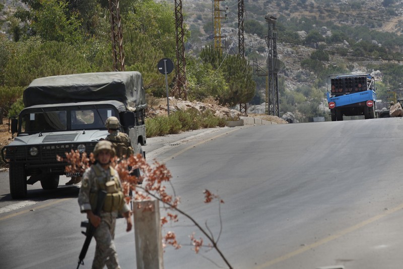 Israeli forces fire artillery from their position on the border with Lebanon after a barrage of rockets were fired from Lebanon, Friday, Aug. 6, 2021. The militant Hezbollah group said it fired rockets near Israeli positions close to the Lebanese border, calling it retaliation for Israeli airstrikes on southern Lebanon a day earlier. (Ayal Margolin/JINIPIX via AP)