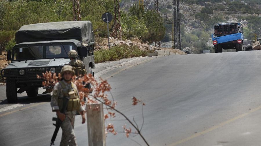 Israeli forces fire artillery from their position on the border with Lebanon after a barrage of rockets were fired from Lebanon, Friday, Aug. 6, 2021. The militant Hezbollah group said it fired rockets near Israeli positions close to the Lebanese border, calling it retaliation for Israeli airstrikes on southern Lebanon a day earlier. (Ayal Margolin/JINIPIX via AP)