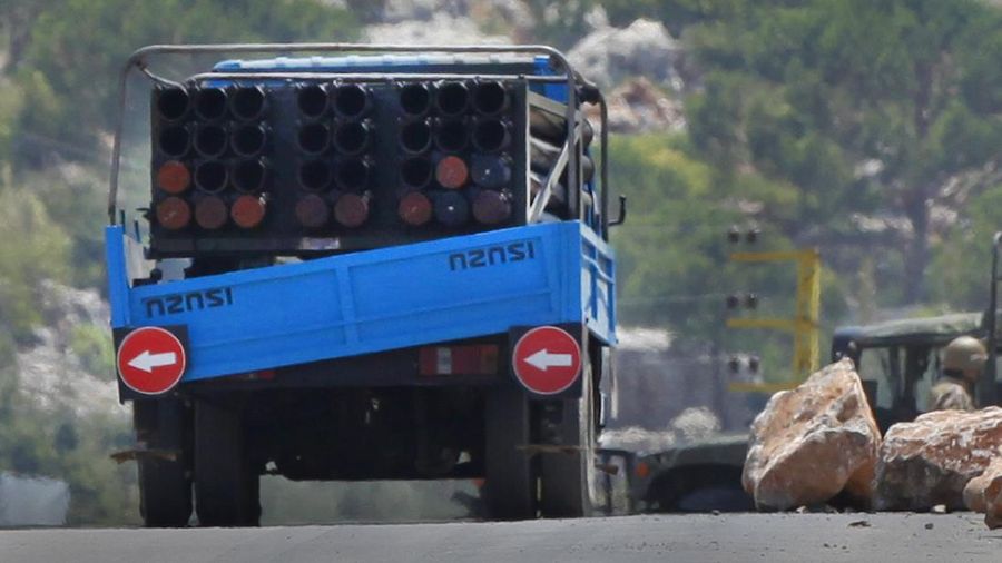 A rocket launcher placed on a pick up truck that was used by Hezbollah to fire rockets near Israeli positions, is seen in the southeastern village of Shwaya, near the border with the Golan Heights, Friday, Aug. 6, 2021. The militant Hezbollah group said it fired a barrage of rockets near Israeli positions close to the Lebanese border on Friday, calling it retaliation for Israeli airstrikes on southern Lebanon a day earlier. (AP Photo/Mohammed Zaatari)