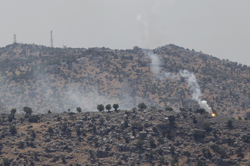 Israeli forces fire artillery from their position on the border with Lebanon after a barrage of rockets were fired from Lebanon, Friday, Aug. 6, 2021. The militant Hezbollah group said it fired rockets near Israeli positions close to the Lebanese border, calling it retaliation for Israeli airstrikes on southern Lebanon a day earlier. (Ayal Margolin/JINIPIX via AP)
