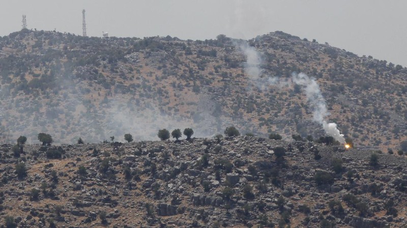 Israeli forces fire artillery from their position on the border with Lebanon after a barrage of rockets were fired from Lebanon, Friday, Aug. 6, 2021. The militant Hezbollah group said it fired rockets near Israeli positions close to the Lebanese border, calling it retaliation for Israeli airstrikes on southern Lebanon a day earlier. (Ayal Margolin/JINIPIX via AP)