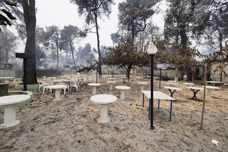 Flames burn on the mountain near Limni village on the island of Evia, about 160 kilometers (100 miles) north of Athens, Greece, Tuesday, Aug. 3, 2021. Greece Tuesday grappled with the worst heatwave in decades that strained the national power supply and fueled wildfires near Athens and elsewhere in southern Greece. As the heat wave scorching the eastern Mediterranean intensified, temperatures reached 42 degrees Celsius (107.6 Fahrenheit) in parts of the Greek capital. (AP Photo/Michael Pappas)