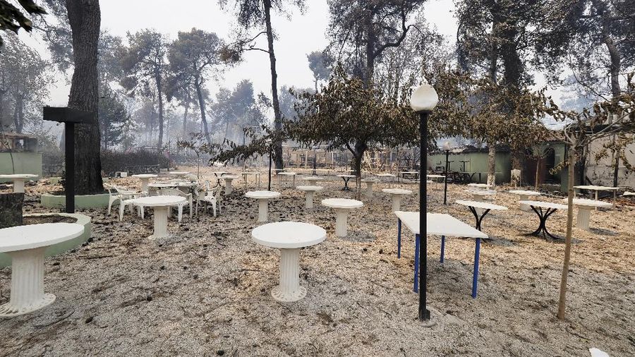 Flames burn on the mountain near Limni village on the island of Evia, about 160 kilometers (100 miles) north of Athens, Greece, Tuesday, Aug. 3, 2021. Greece Tuesday grappled with the worst heatwave in decades that strained the national power supply and fueled wildfires near Athens and elsewhere in southern Greece. As the heat wave scorching the eastern Mediterranean intensified, temperatures reached 42 degrees Celsius (107.6 Fahrenheit) in parts of the Greek capital. (AP Photo/Michael Pappas)