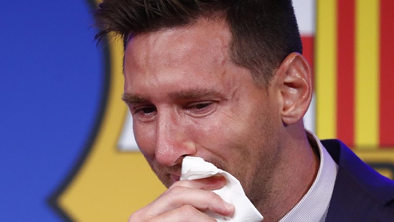 Lionel Messi cries at the start of a press conference at the Camp Nou stadium in Barcelona, Spain, Sunday, Aug. 8, 2021. FC Barcelona had previously announced the negotiations with Lionel Messi had ended and that Messi would be leaving the club. (AP Photo/Joan Monfort)