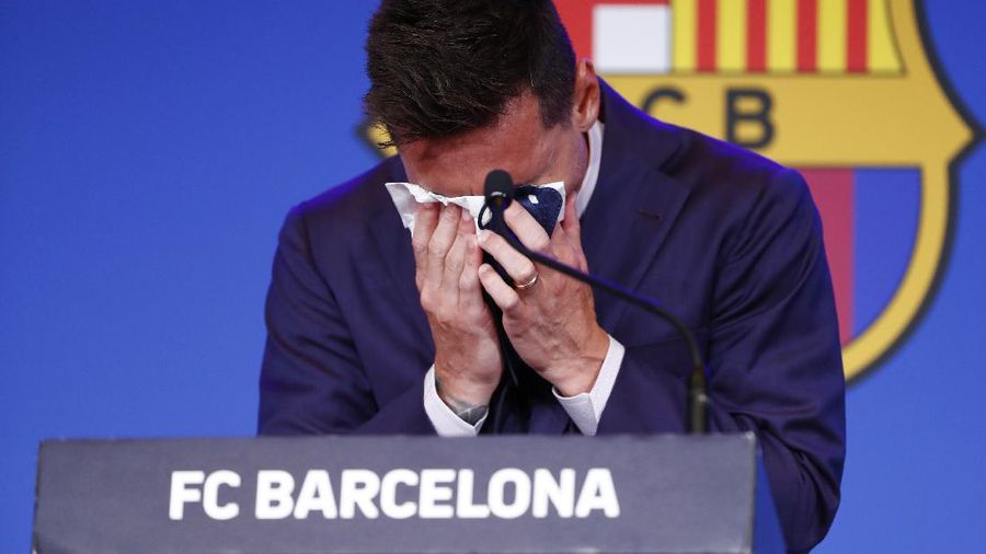 Lionel Messi cries at the start of a press conference at the Camp Nou stadium in Barcelona, Spain, Sunday, Aug. 8, 2021. FC Barcelona had previously announced the negotiations with Lionel Messi had ended and that Messi would be leaving the club. (AP Photo/Joan Monfort)